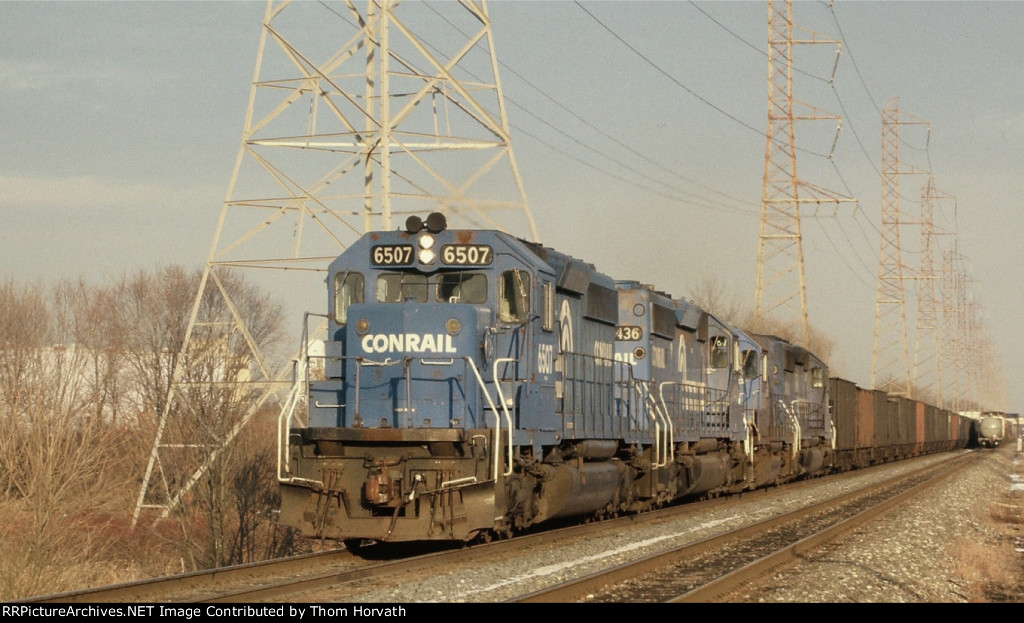CR 6507 leads an empty coal train west past the Waterworks facility